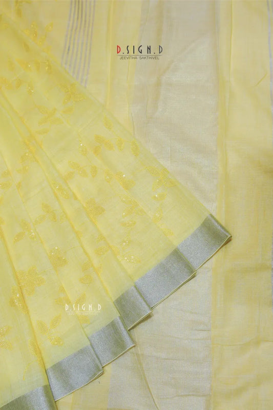 PASTEL YELLOW SEQUIN FLORAL LINEN SAREE.