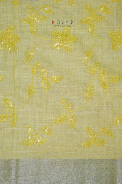 PASTEL YELLOW SEQUIN FLORAL LINEN SAREE.